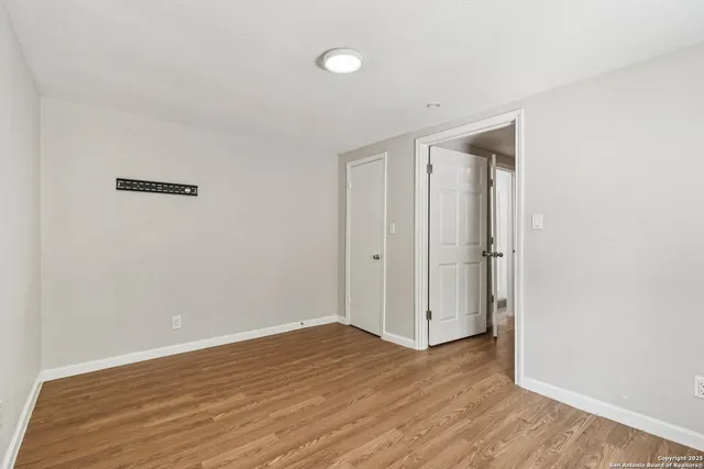 a view of a room with wooden walls and roof