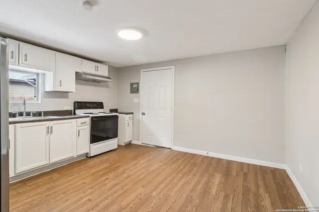 a view of a room with wooden walls