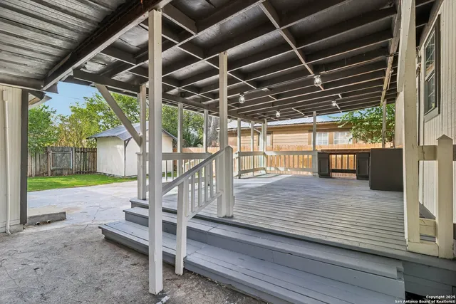a view of a house with backyard porch and sitting area