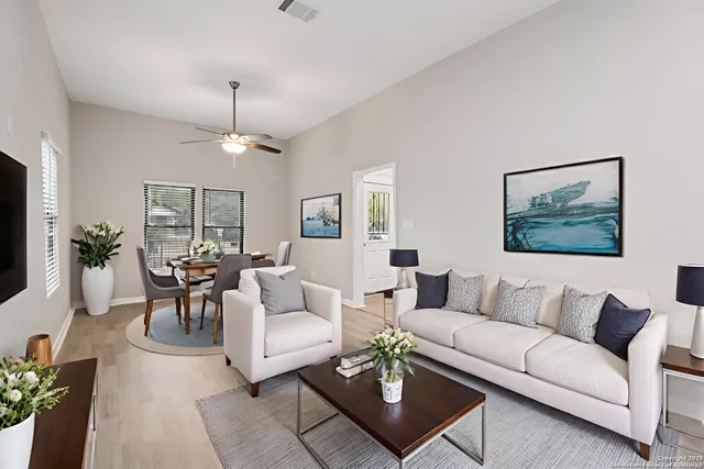 a view of a hallway with wooden floor and kitchen