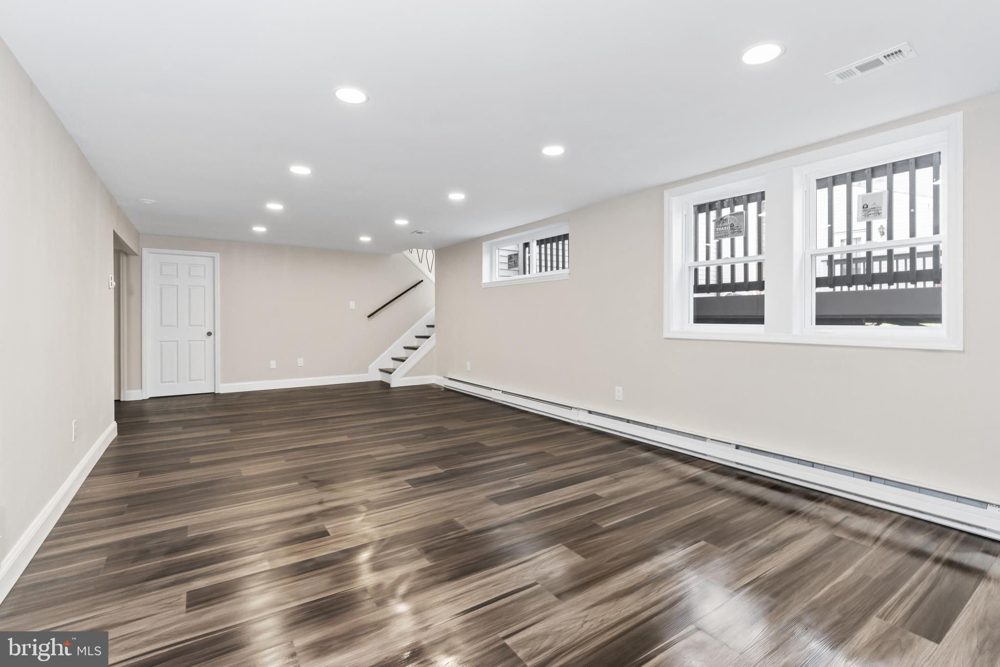 628 South Brownleaf Road Newark, DE 19713 - Photo 22 of 36 an empty room with wooden floor and windows