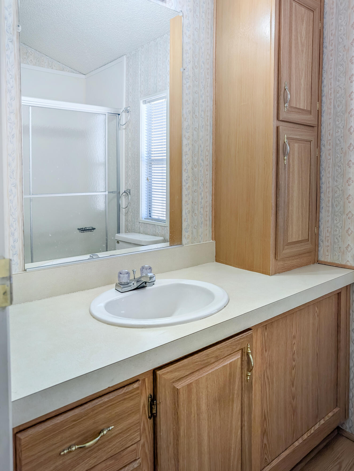 70200 Dillon Road, Unit 422 Desert Hot Springs, CA 92241 - Photo 18 of 25 a bathroom with a sink and a mirror