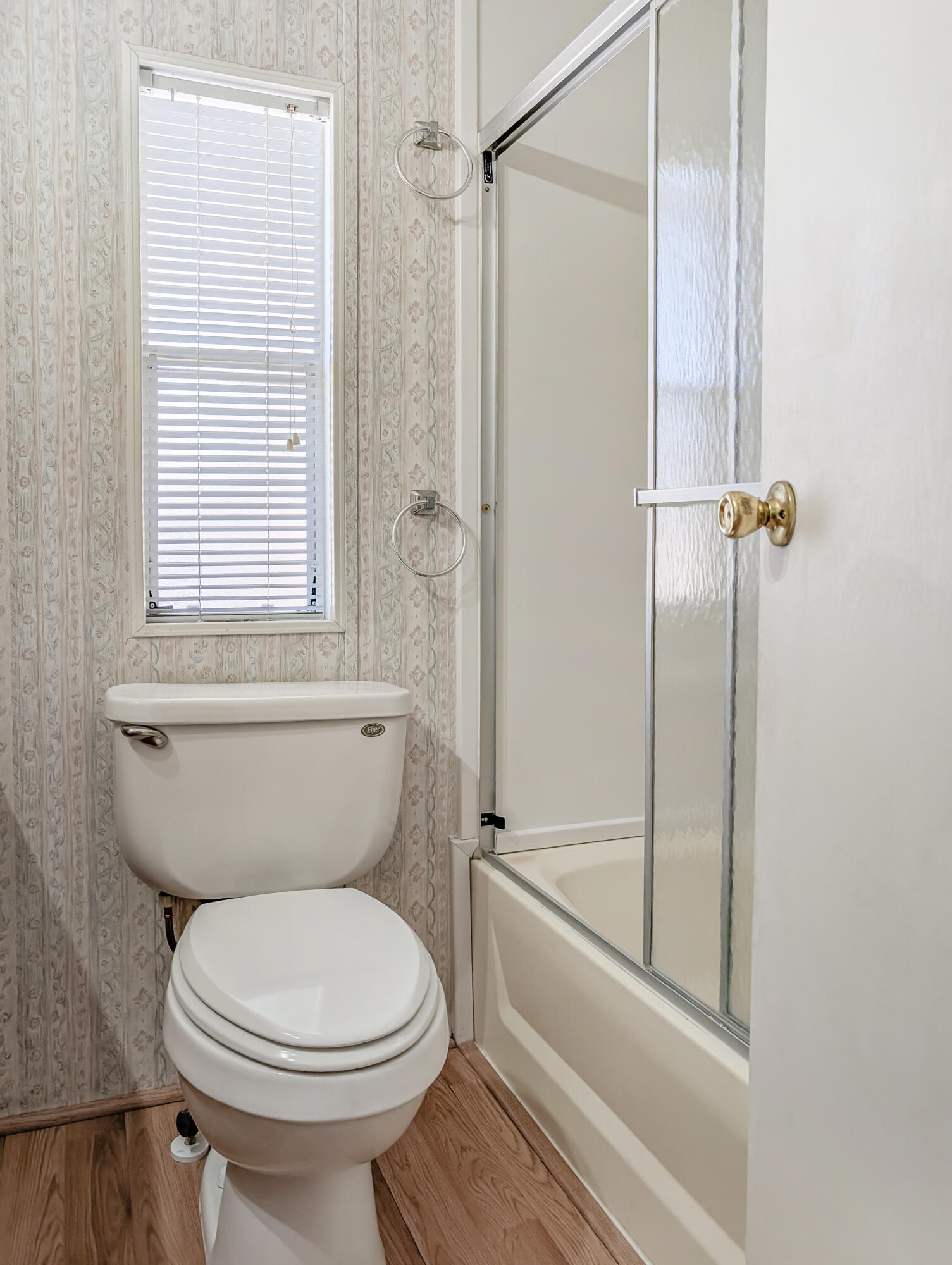 70200 Dillon Road, Unit 422 Desert Hot Springs, CA 92241 - Photo 19 of 25 a bathroom with a toilet and a shower