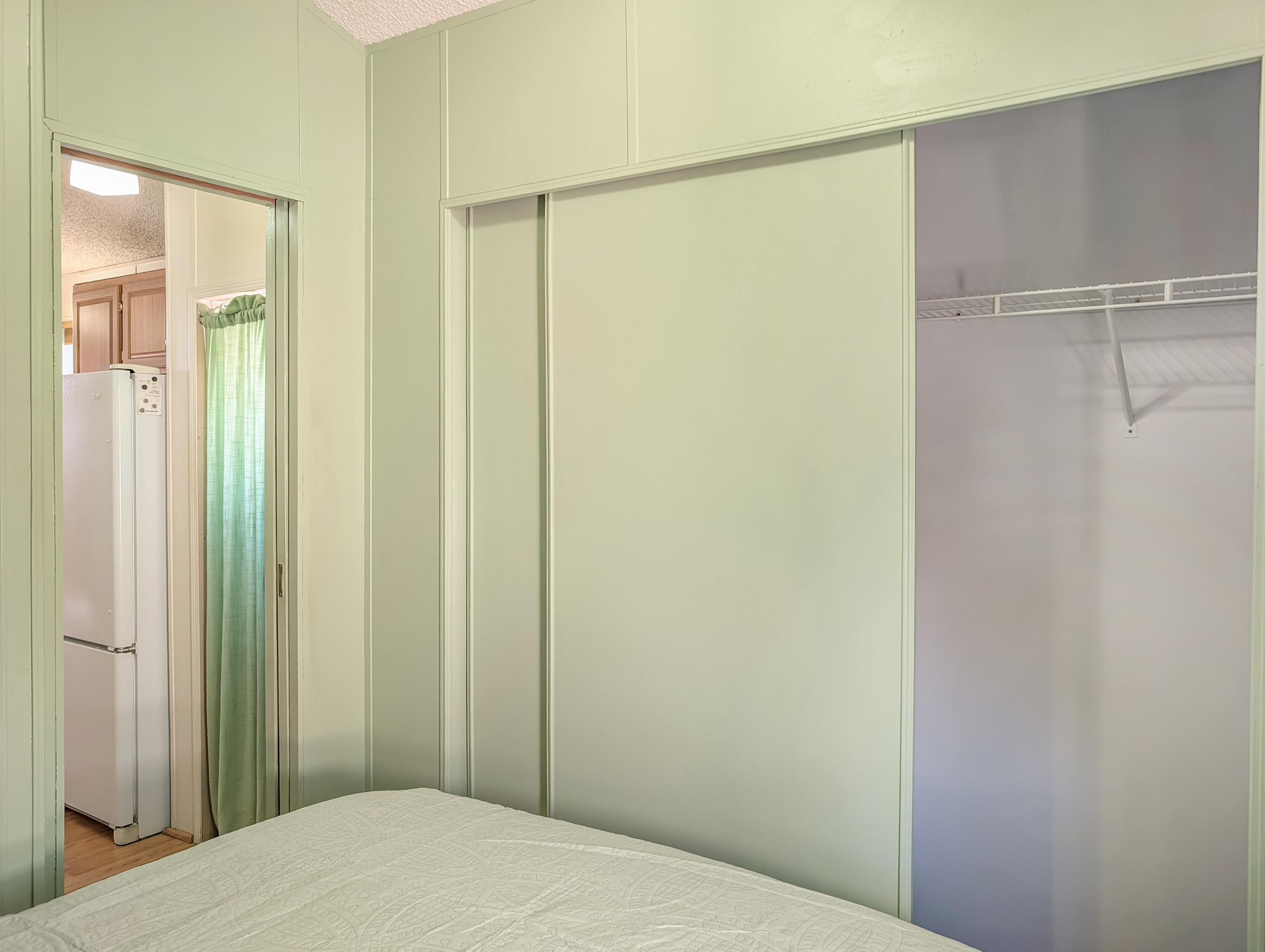70200 Dillon Road, Unit 422 Desert Hot Springs, CA 92241 - Photo 22 of 25 a bedroom with a bed and a shower