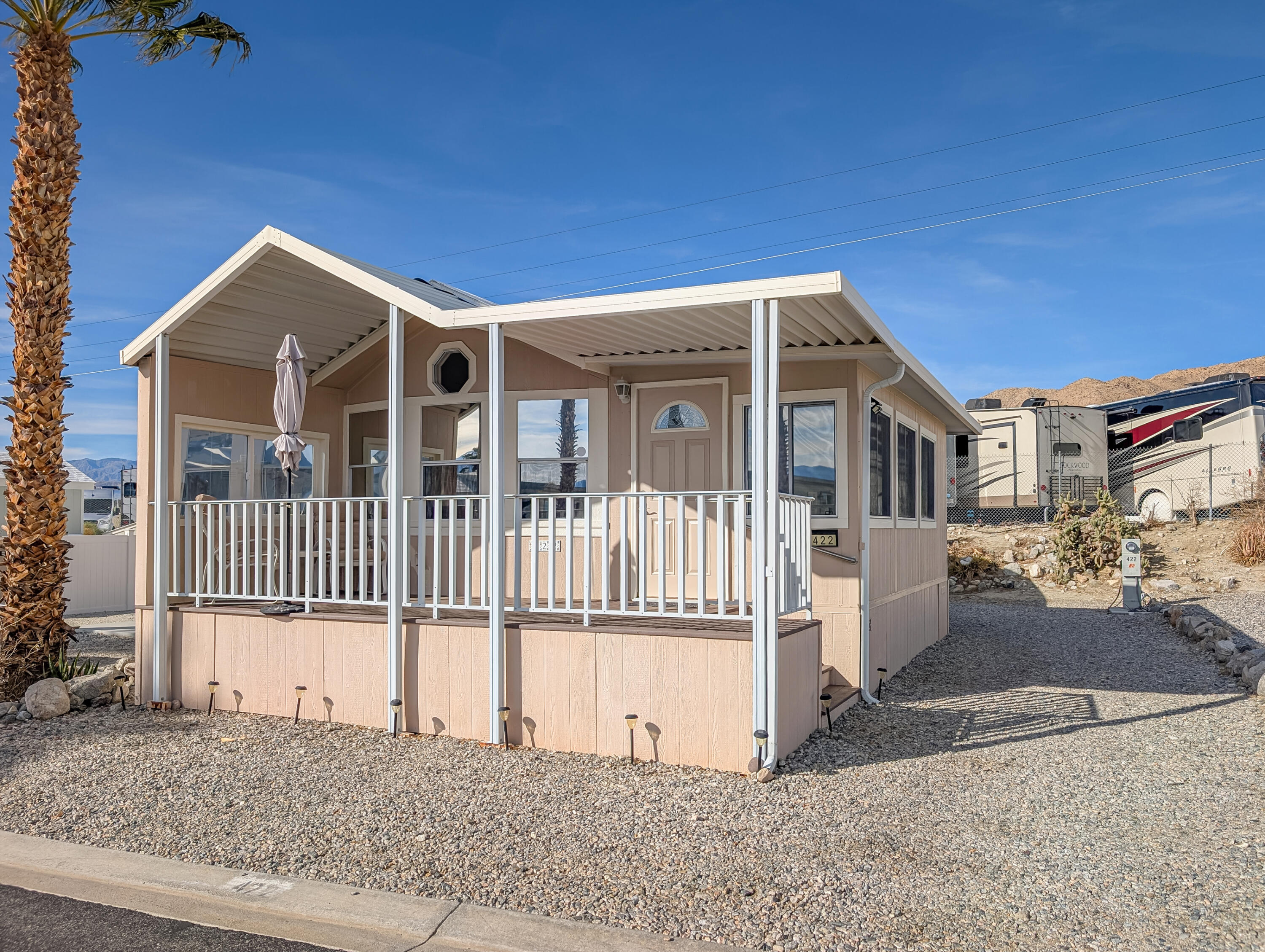 70200 Dillon Road, Unit 422 Desert Hot Springs, CA 92241 - Photo 3 of 25 front view of a house with a fence