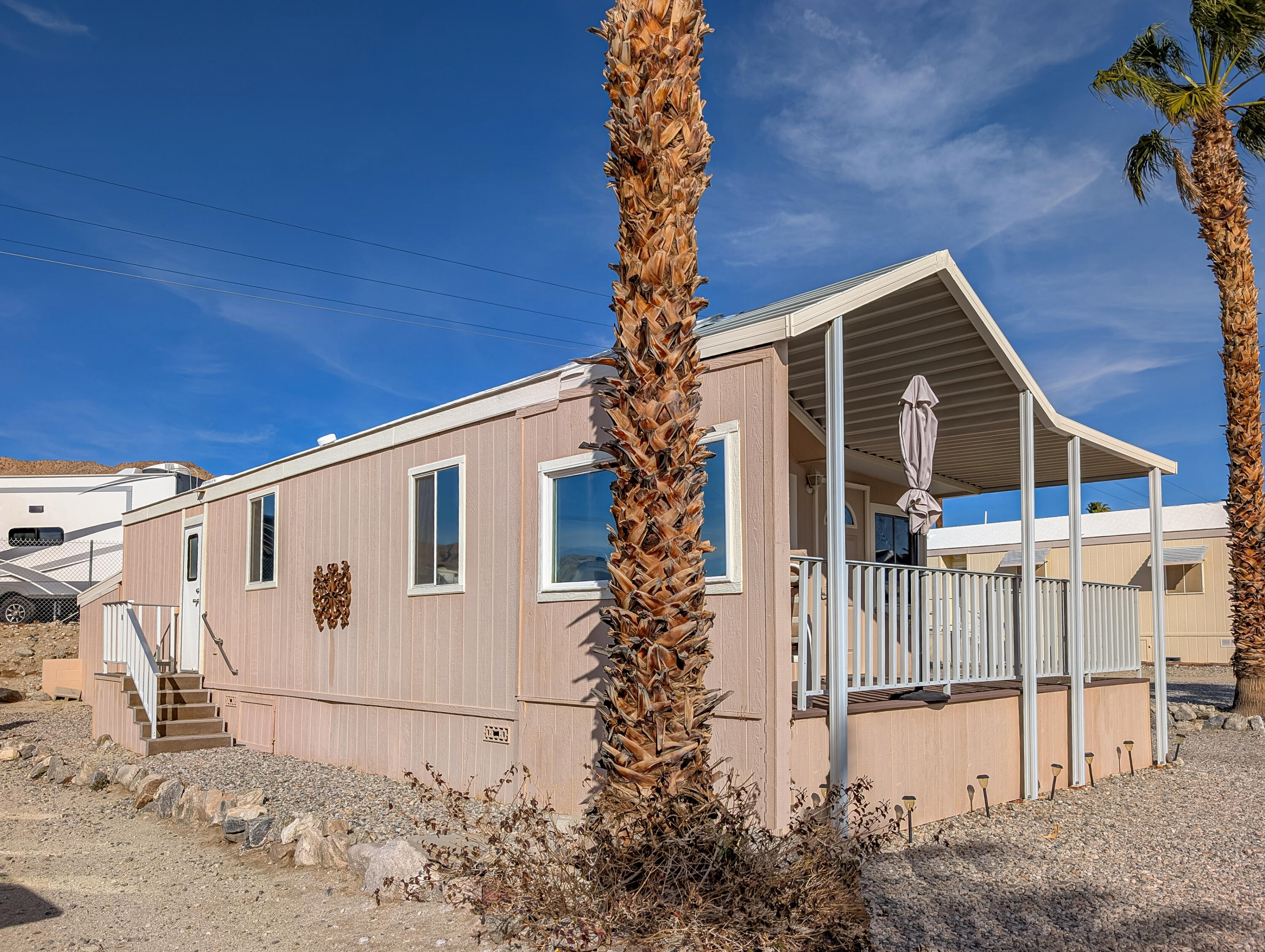 70200 Dillon Road, Unit 422 Desert Hot Springs, CA 92241 - Photo 4 of 25 a view of a house with backyard