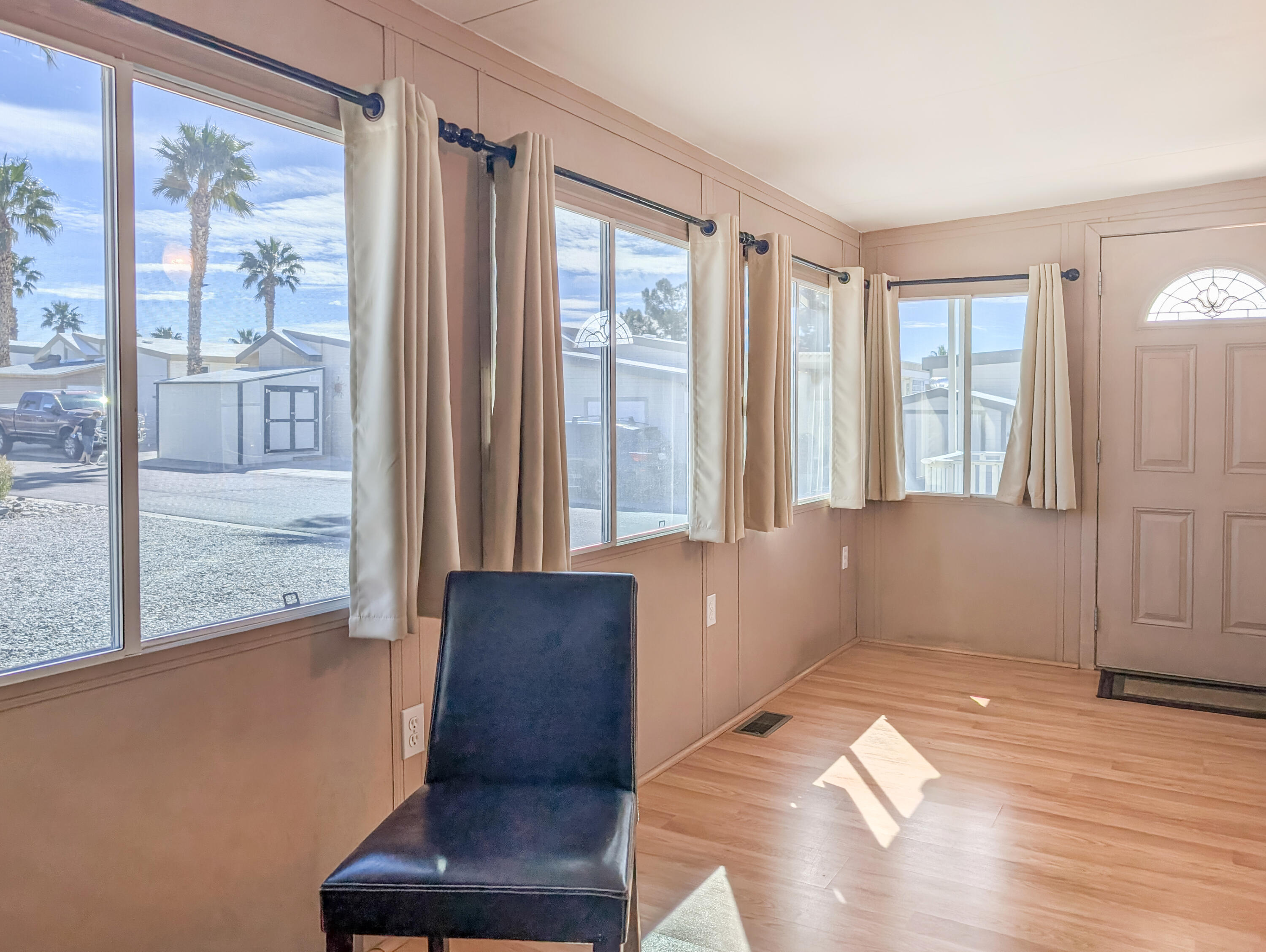 70200 Dillon Road, Unit 422 Desert Hot Springs, CA 92241 - Photo 9 of 25 a living room with furniture and large windows