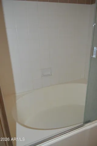 a view of a swimming pool with a lounge chairs