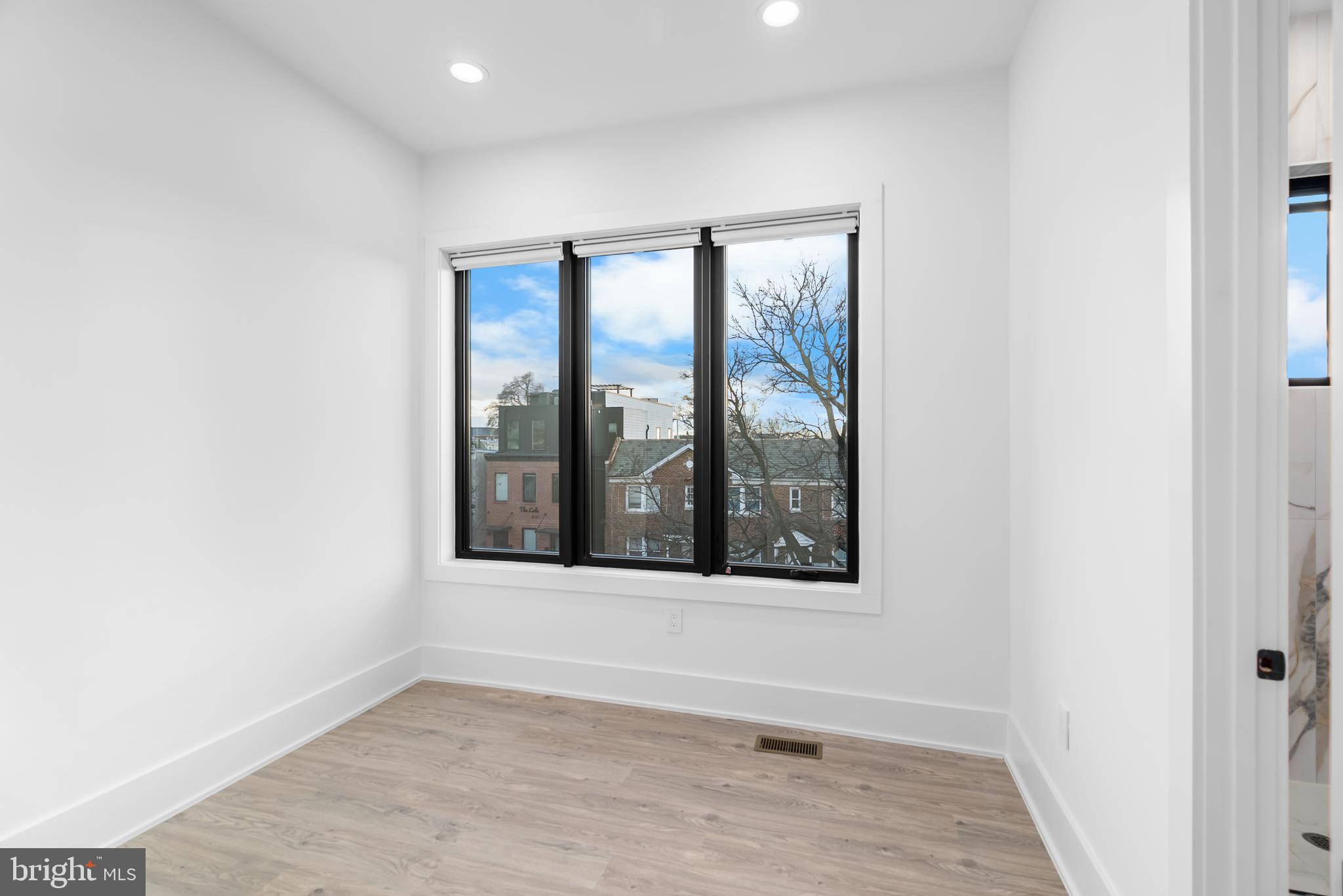 1140 Oates Street Northeast, Unit 202 Washington, DC 20002 - Photo 39 of 48 a view of an empty room with a window