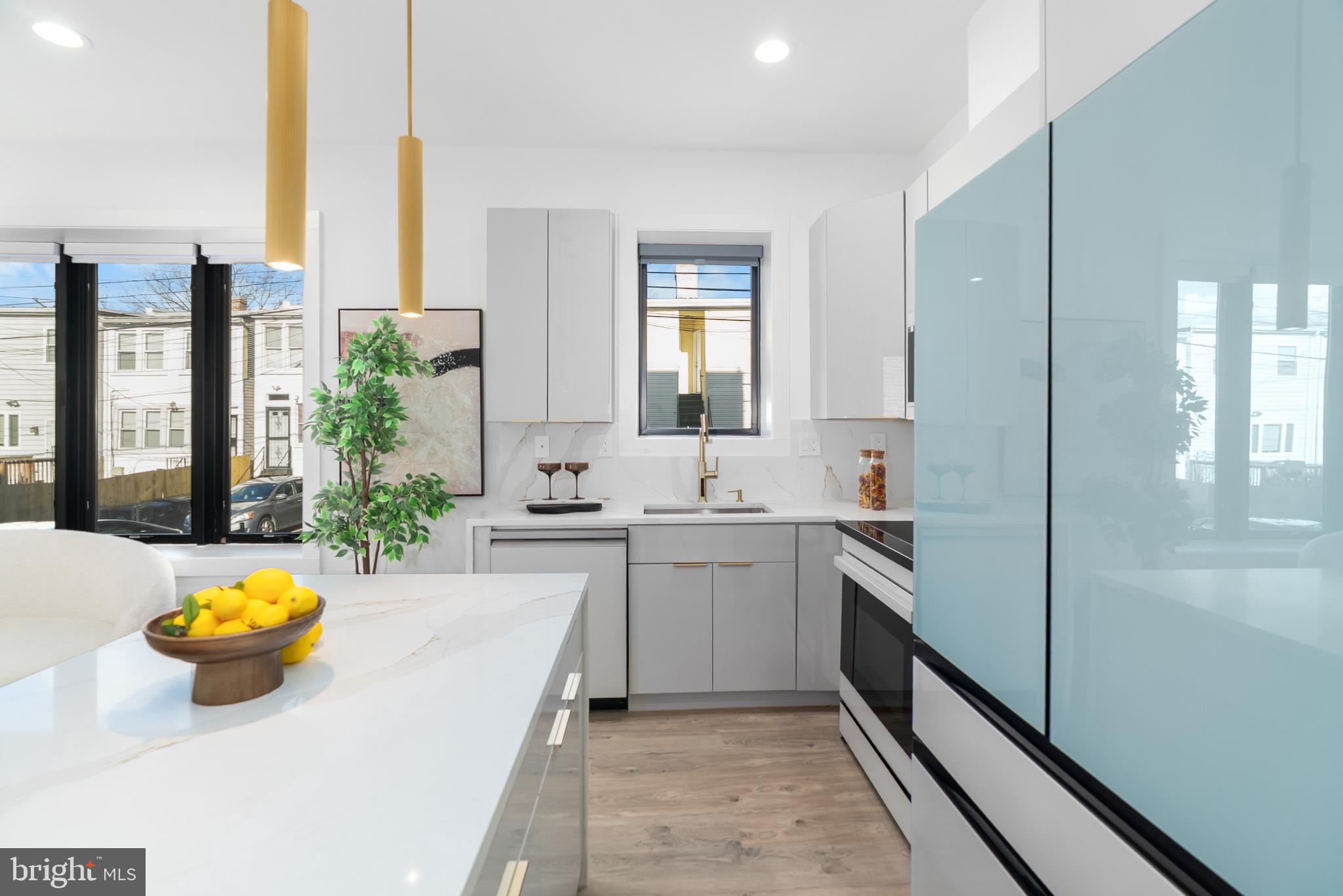 1140 Oates Street Northeast, Unit 202 Washington, DC 20002 - Photo 7 of 48 a bathroom with a tub a sink and a window