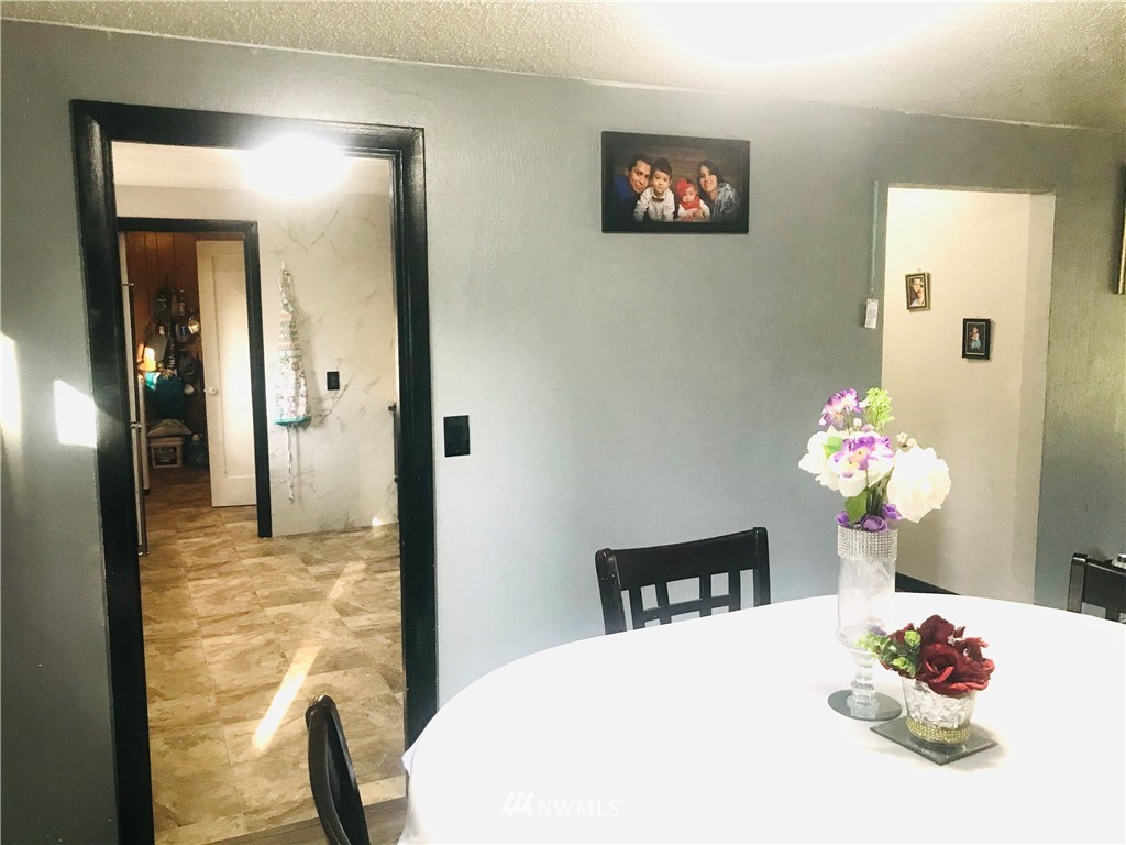 8410 Custer Road Southwest Lakewood, WA 98499 - Photo 11 of 16 a dining room with furniture and wooden floor