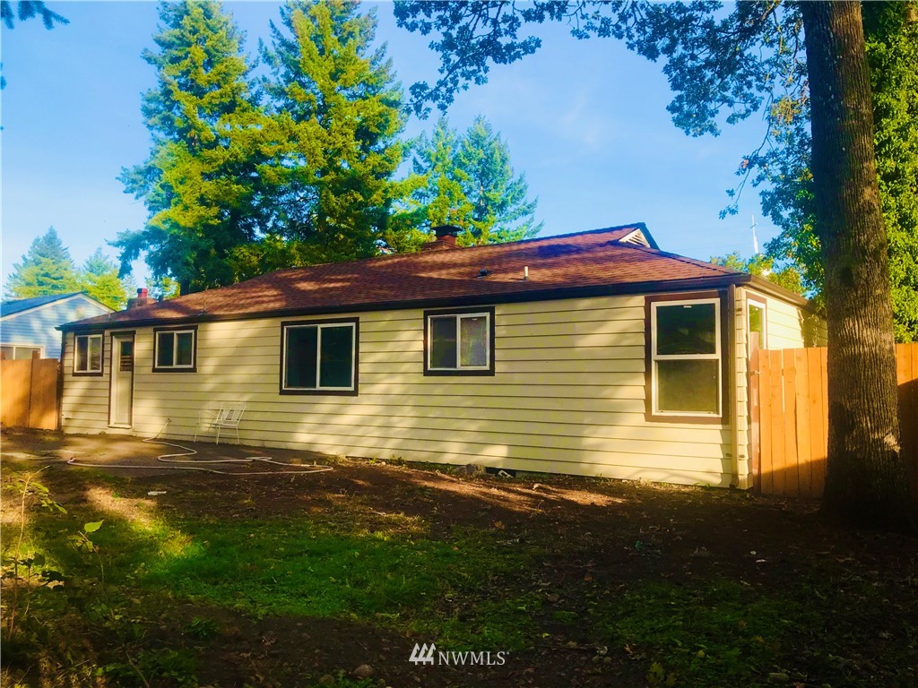 8410 Custer Road Southwest Lakewood, WA 98499 - Photo 3 of 16 a view of a house with a backyard