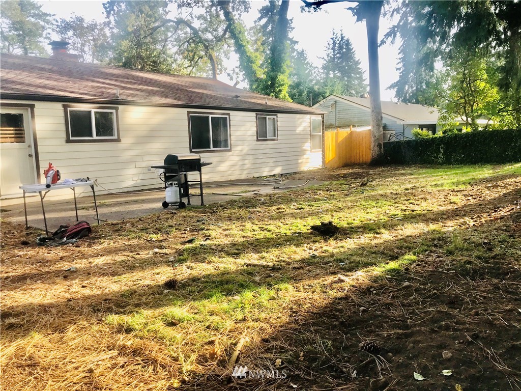 8410 Custer Road Southwest Lakewood, WA 98499 - Photo 4 of 16 a view of a house with backyard