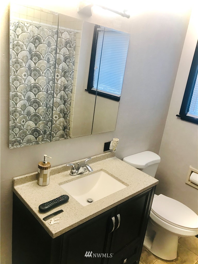 8410 Custer Road Southwest Lakewood, WA 98499 - Photo 10 of 16 a bathroom with a sink and a toilet