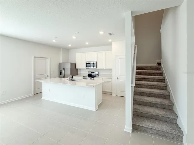 a view of kitchen with wooden floor