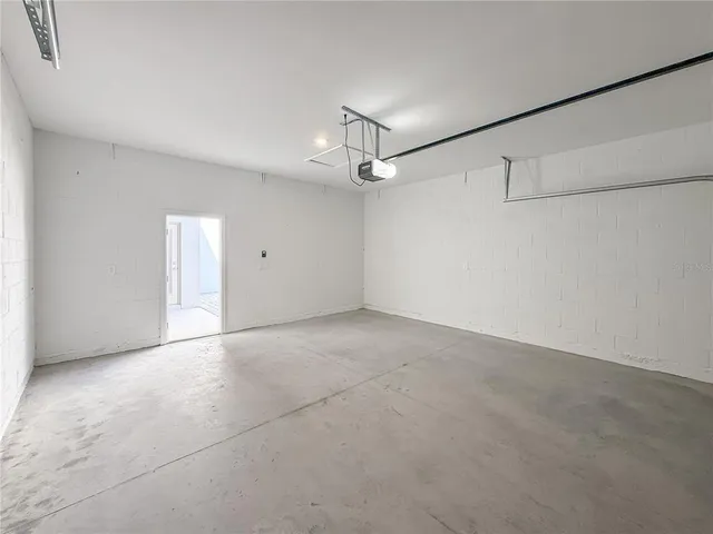 an aerial view of multiple houses with yard