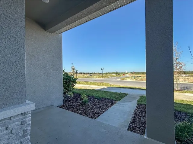 a view of a room next to a yard