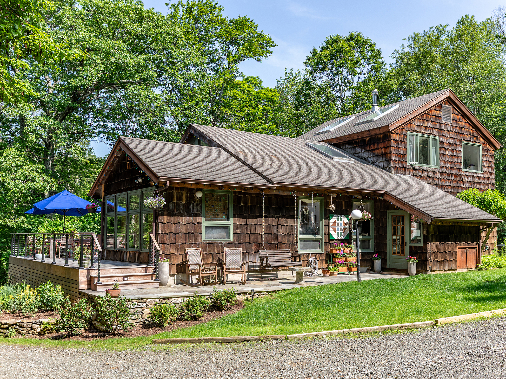 a front view of a house with garden