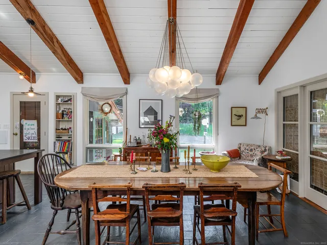 a kitchen with granite countertop a sink a stove and cabinets