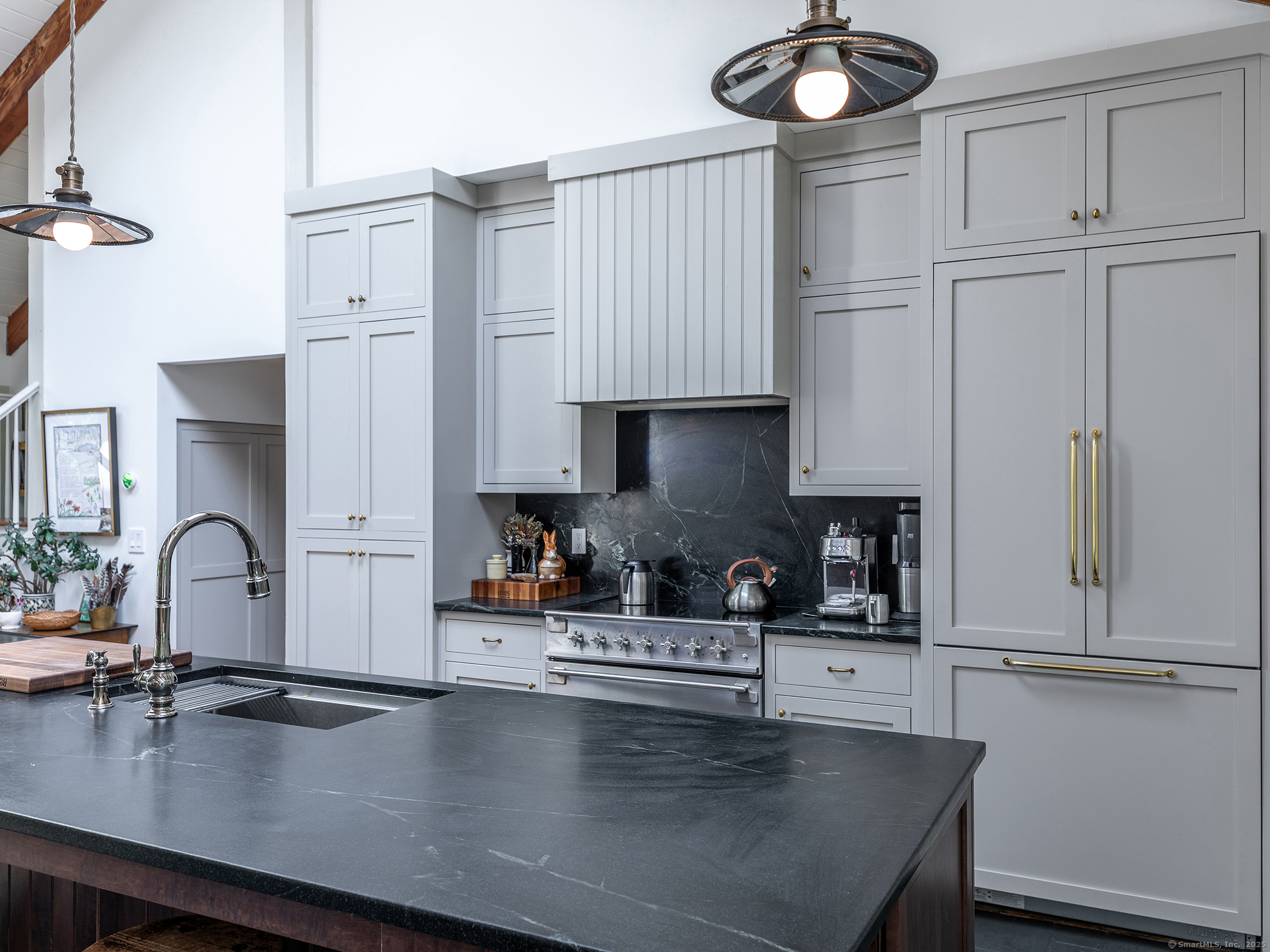 203 Brick School Road Warren, CT 06754 - Photo 17 of 40 a kitchen with granite countertop a sink a stove and cabinets