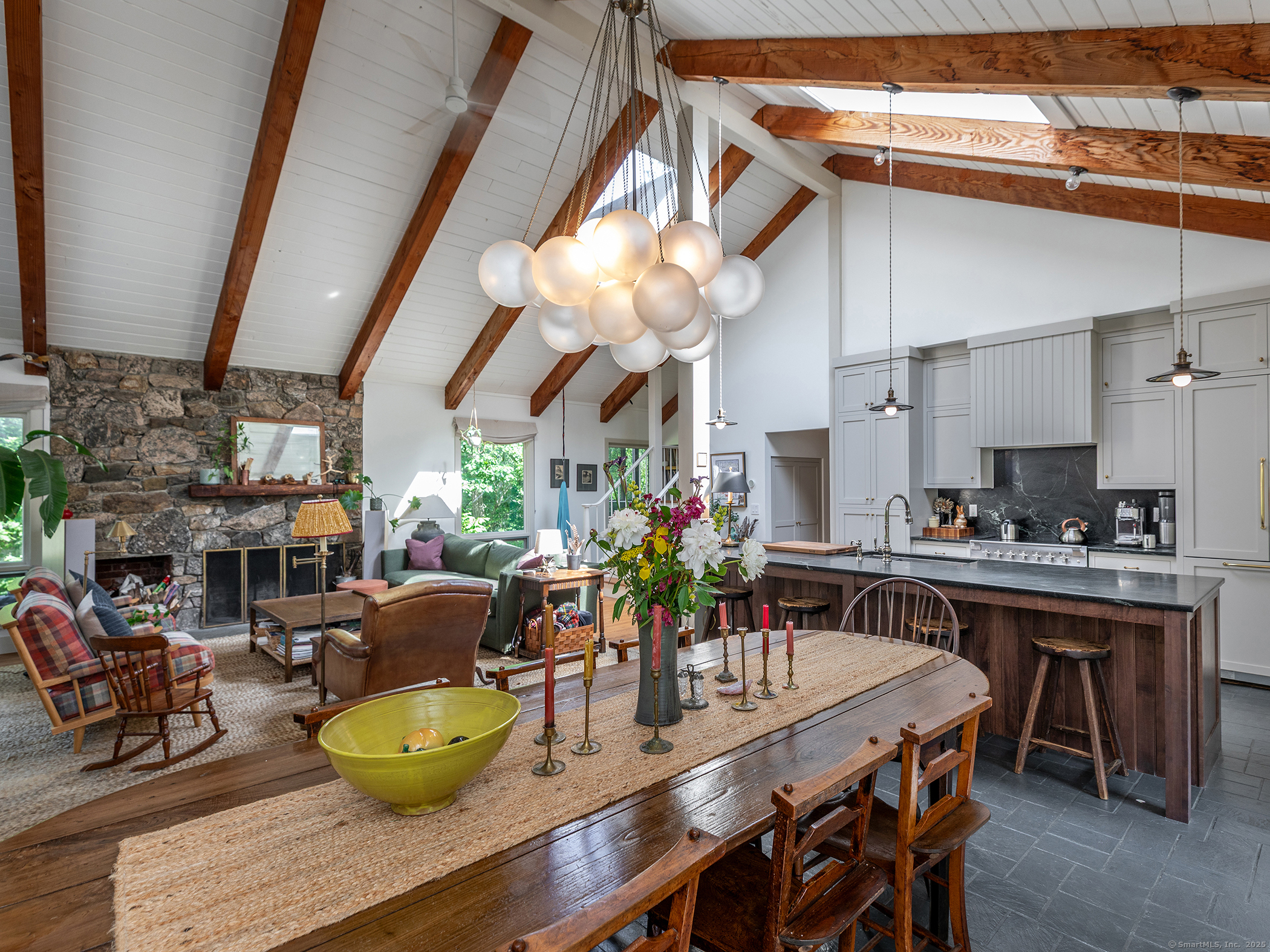 203 Brick School Road Warren, CT 06754 - Photo 18 of 40 a dining room with furniture and a kitchen view
