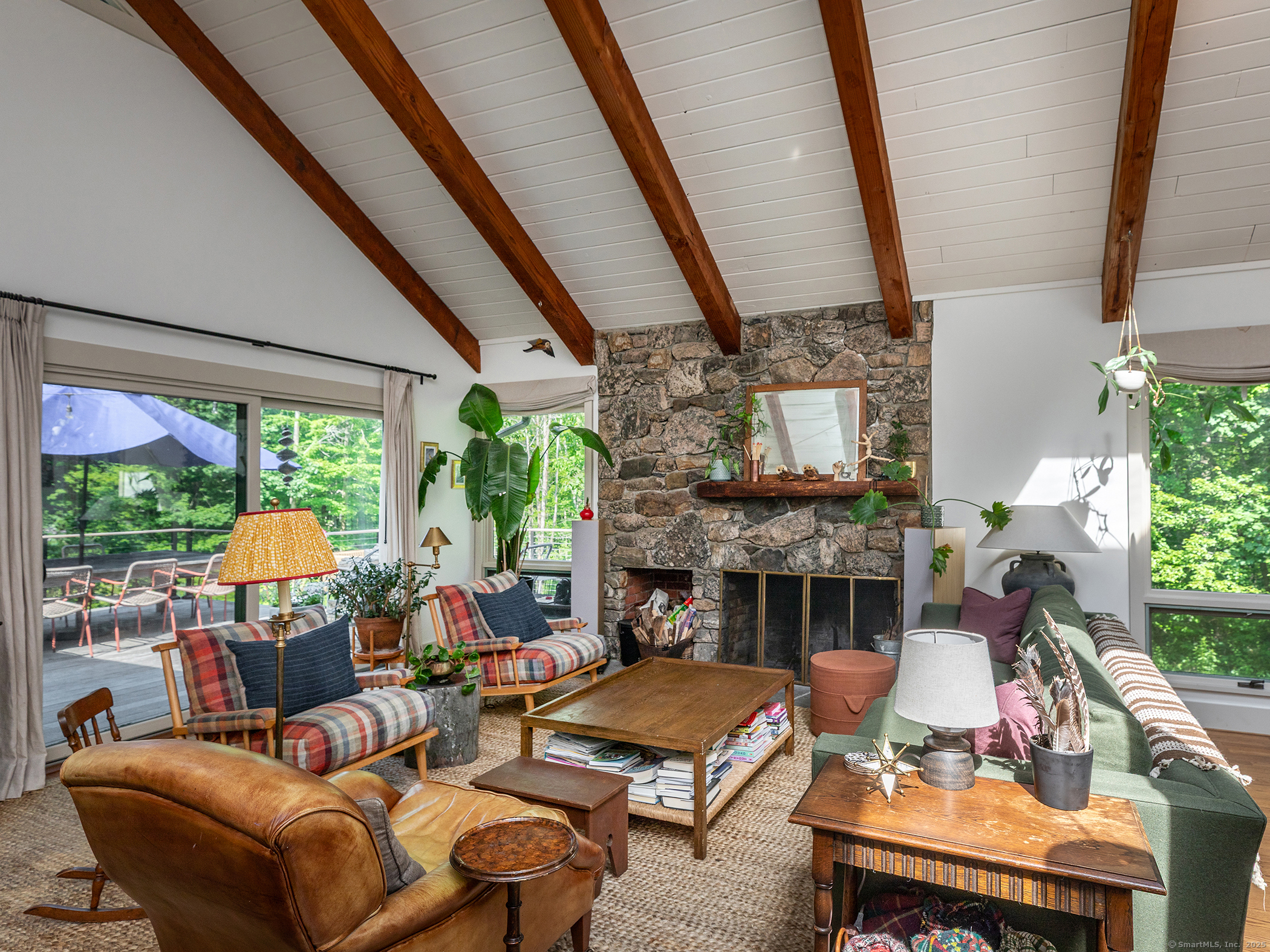 203 Brick School Road Warren, CT 06754 - Photo 19 of 40 a living room with furniture fireplace and a large window