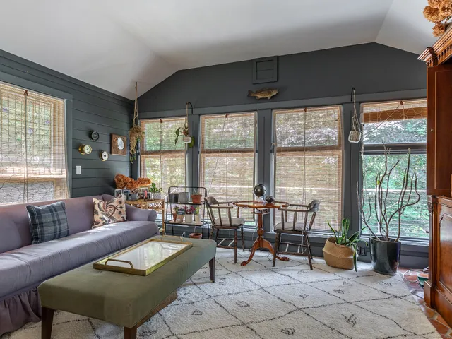a bathroom with a granite countertop sink a toilet and a mirror