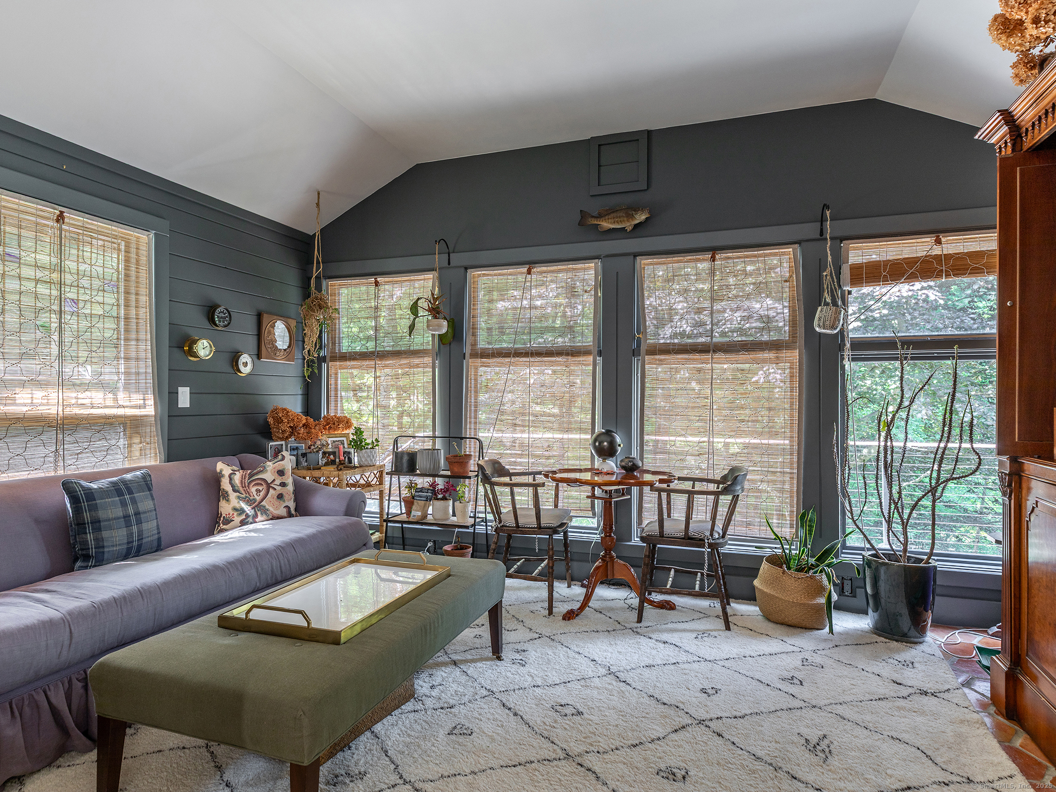 203 Brick School Road Warren, CT 06754 - Photo 22 of 40 a living room with furniture and floor to ceiling windows
