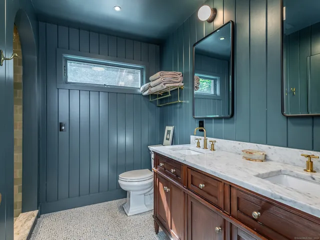 a balcony with furniture and a potted plant
