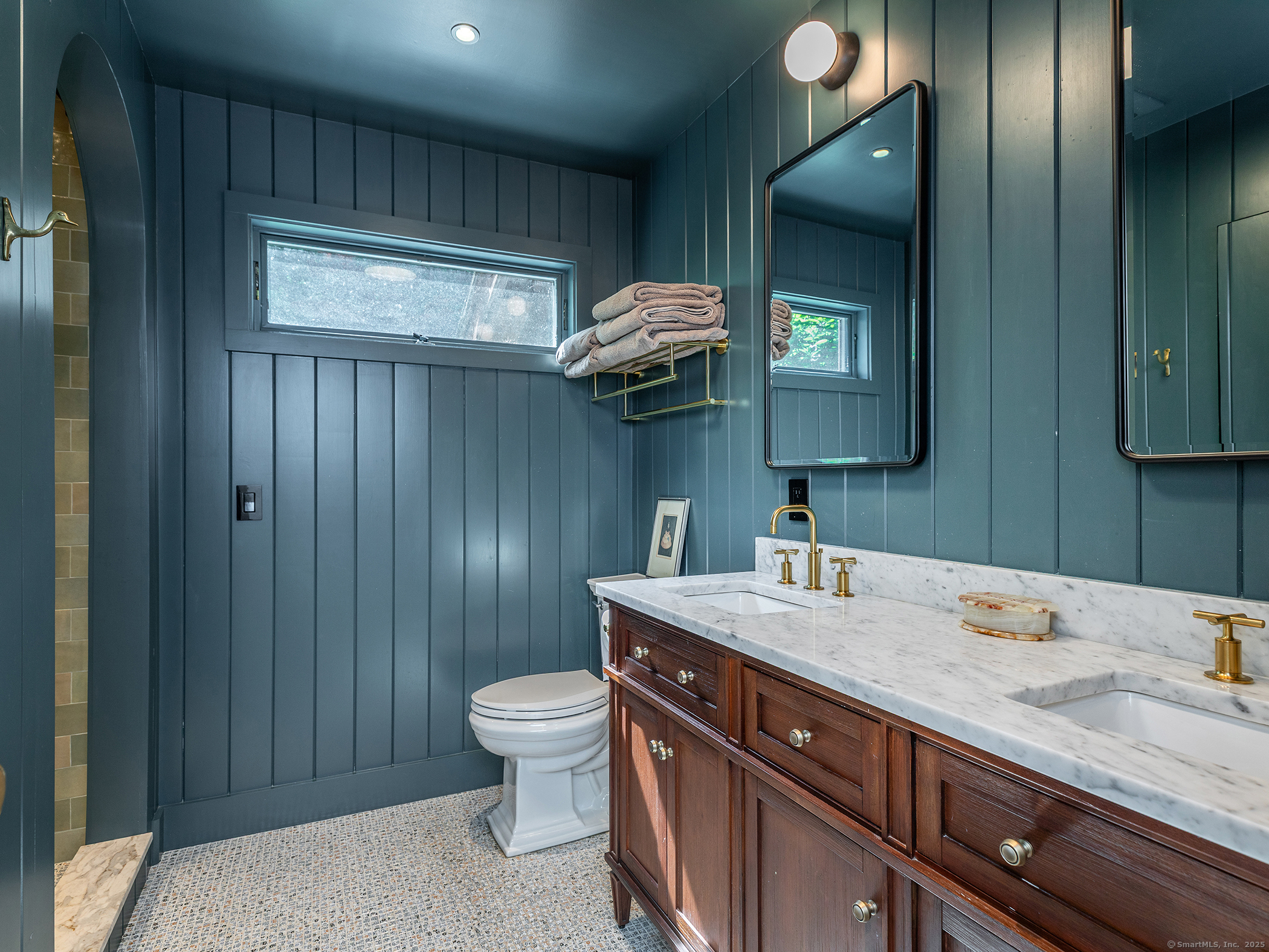 203 Brick School Road Warren, CT 06754 - Photo 24 of 40 a bathroom with a granite countertop sink a toilet and a mirror
