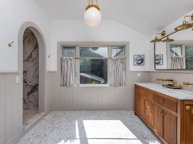 a view of a window and dining room with furniture and window