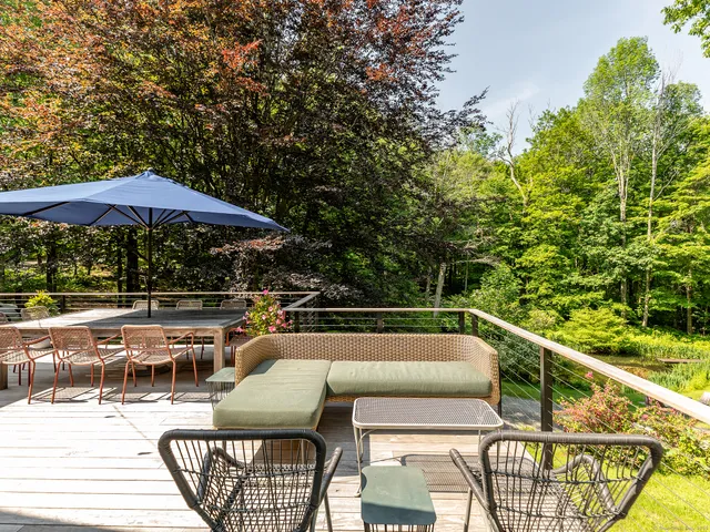 a view of a chairs and tables in the balcony