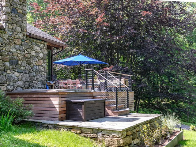 a view of a table and chairs in the garden