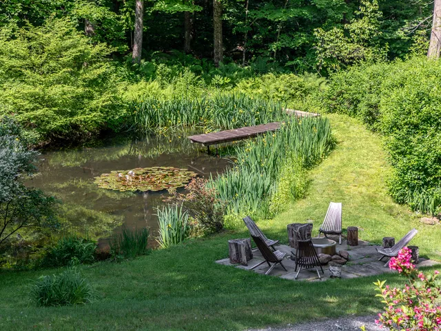 a view of a backyard with sitting area and furniture
