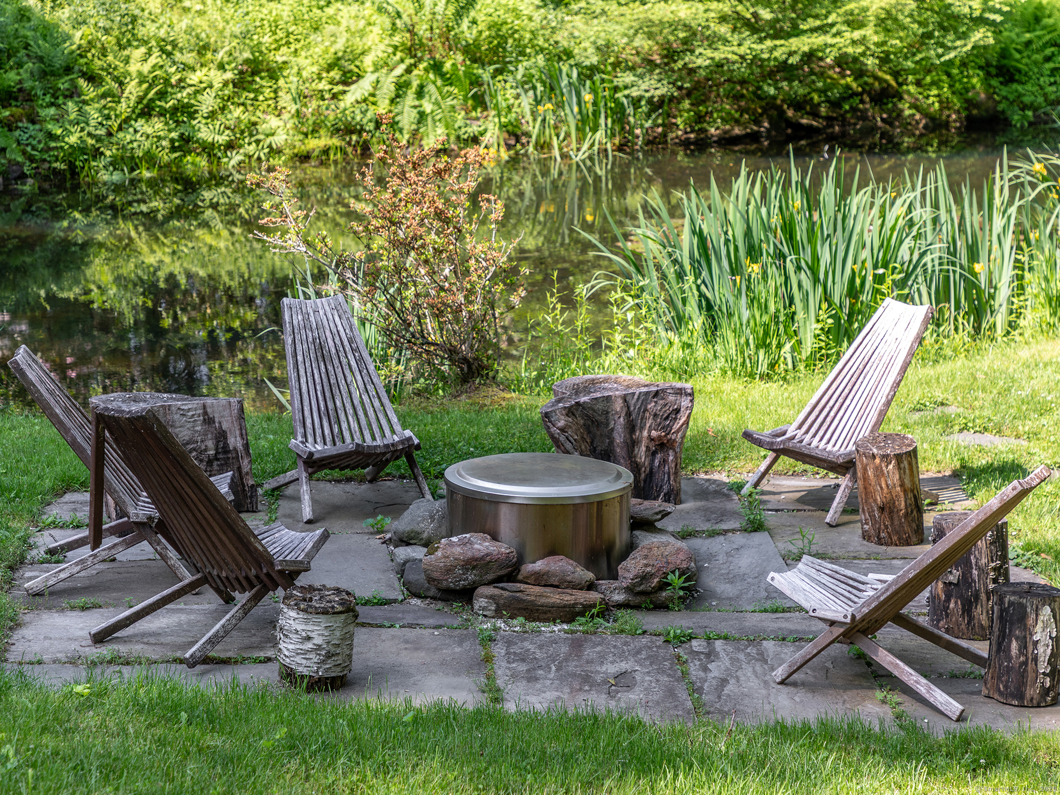 203 Brick School Road Warren, CT 06754 - Photo 10 of 40 a view of a backyard with sitting area and furniture