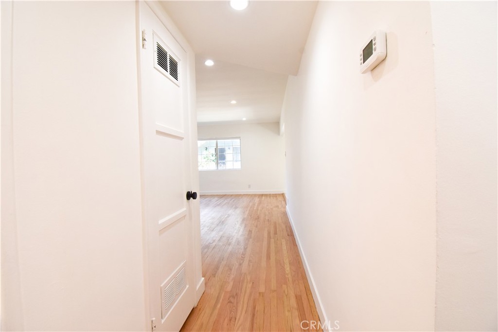 1570 North Verdugo Road, Unit B Glendale, CA 91208 - Photo 12 of 12 a view of a room with wooden floor and a ceiling fan