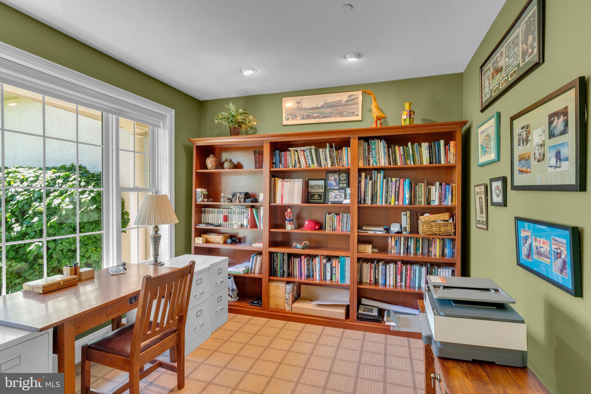 115 Muirfield Lane Chalfont, PA 18914 - Photo 11 of 59 a living room with furniture a book shelf and a book shelf