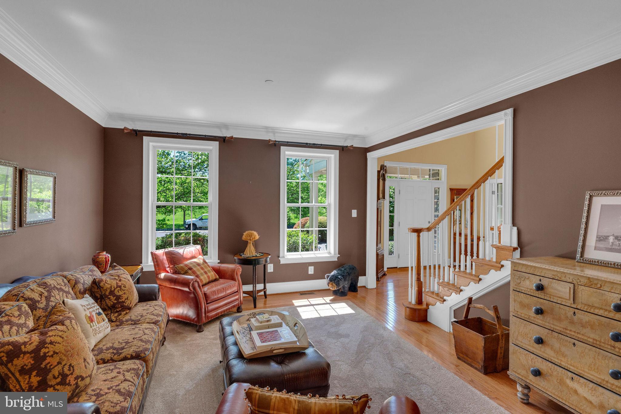 115 Muirfield Lane Chalfont, PA 18914 - Photo 13 of 59 a living room with furniture wooden floor and a large window