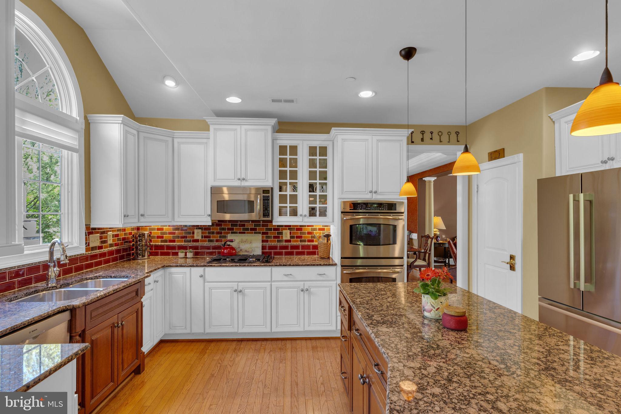 115 Muirfield Lane Chalfont, PA 18914 - Photo 17 of 59 a kitchen with stainless steel appliances granite countertop a sink stove and refrigerator