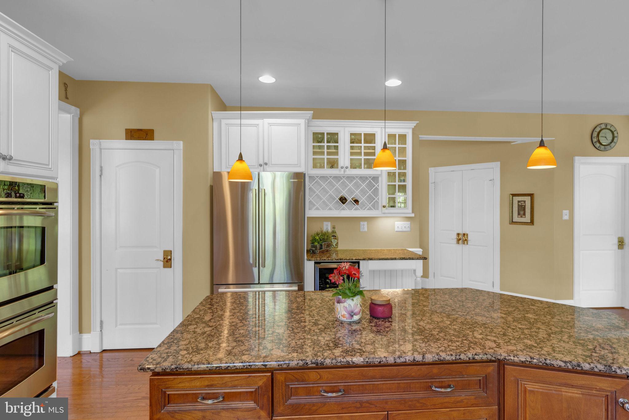 115 Muirfield Lane Chalfont, PA 18914 - Photo 18 of 59 a kitchen with refrigerator and natural light