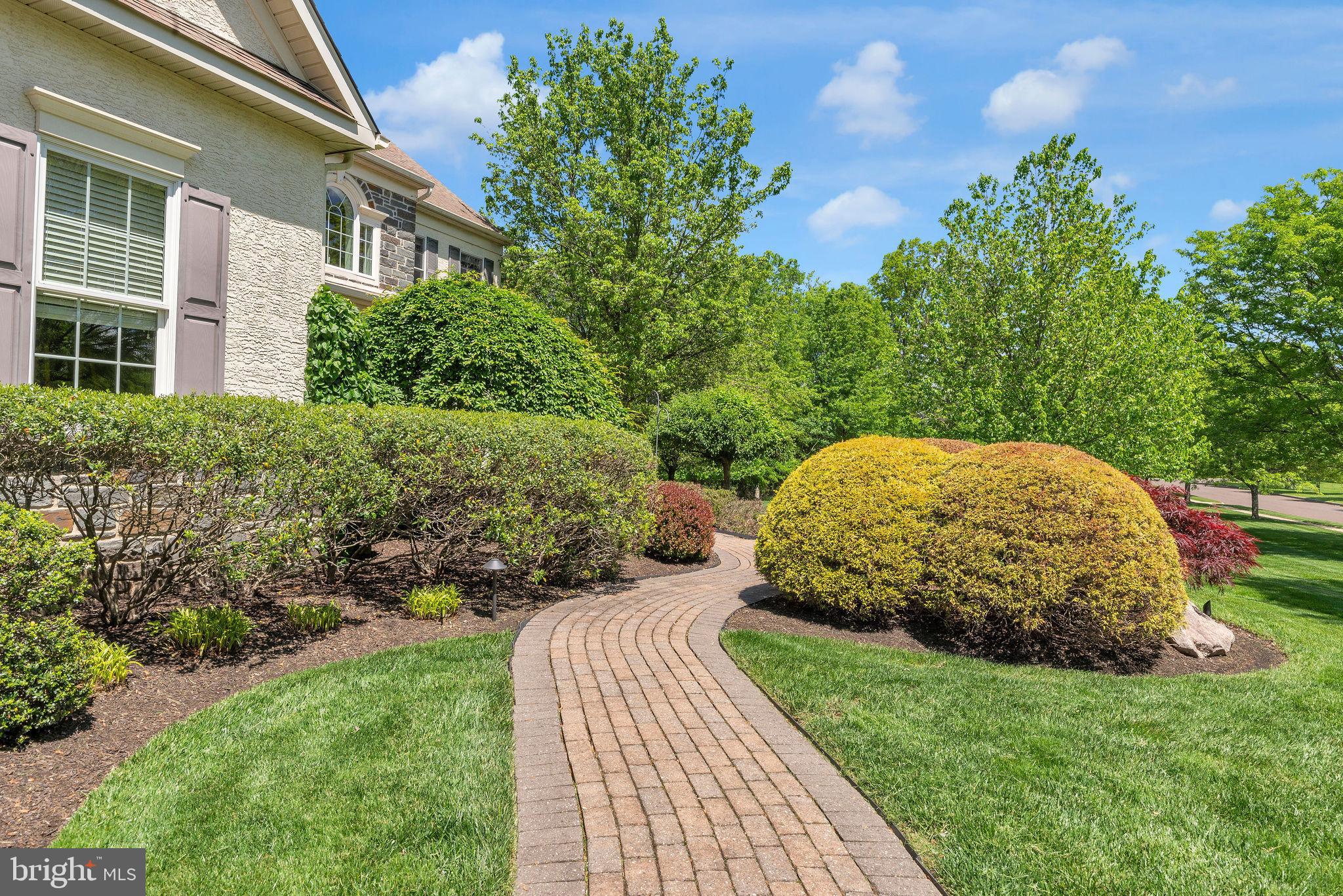 115 Muirfield Lane Chalfont, PA 18914 - Photo 2 of 59 a view of a backyard with plants and a garden