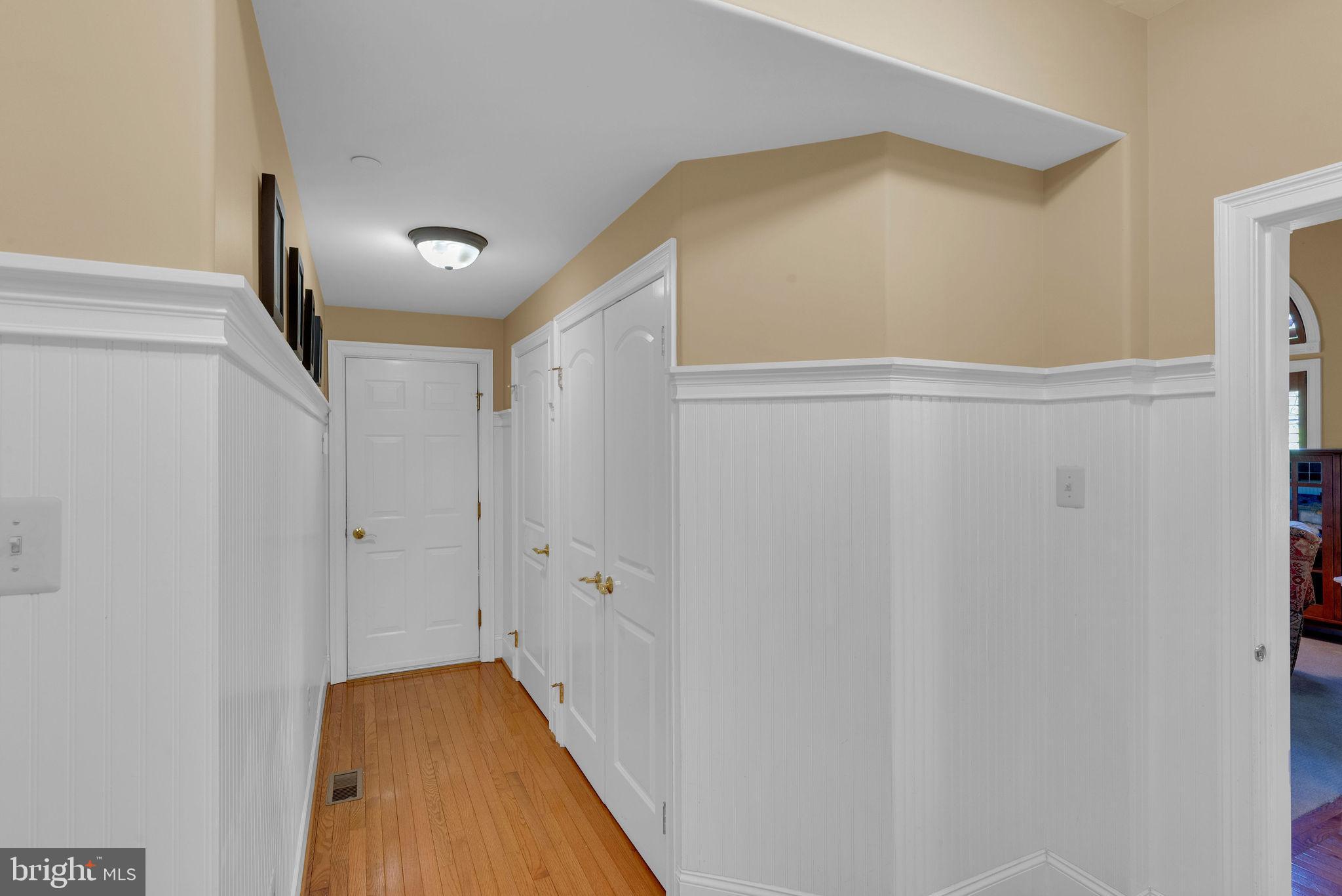 115 Muirfield Lane Chalfont, PA 18914 - Photo 23 of 59 a view of a hallway with wooden floor