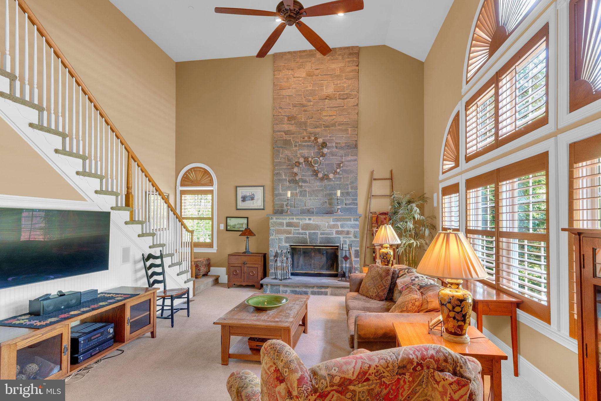 115 Muirfield Lane Chalfont, PA 18914 - Photo 25 of 59 Family room with Bluestone FP & rear stairs