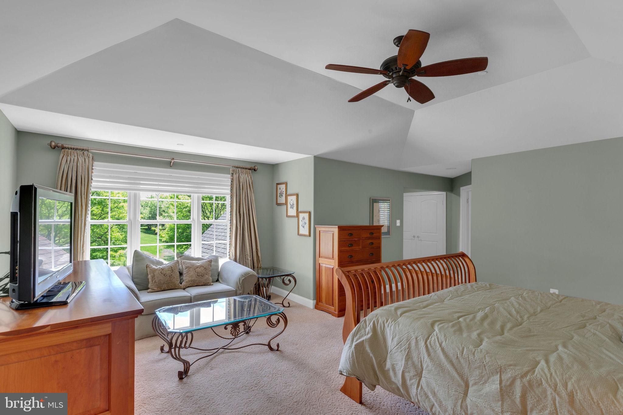 115 Muirfield Lane Chalfont, PA 18914 - Photo 30 of 59 a bedroom with a bed a couch and a window
