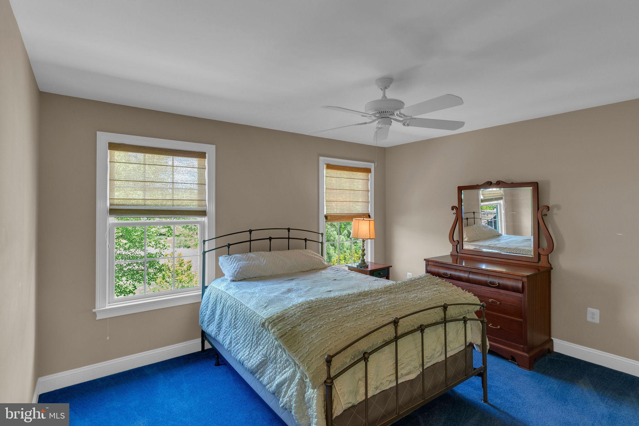 115 Muirfield Lane Chalfont, PA 18914 - Photo 35 of 59 a bedroom with a bed and a chandelier