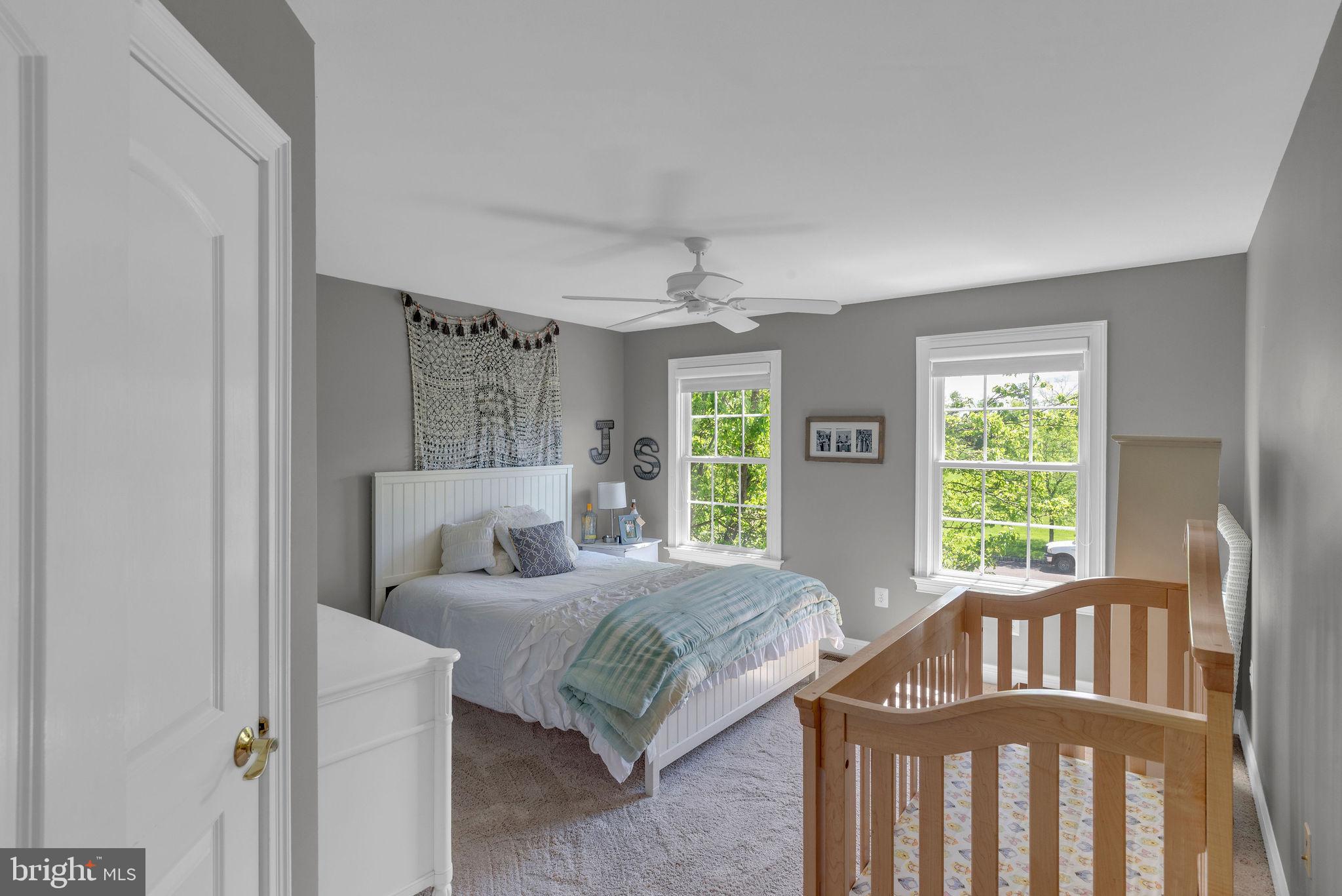 115 Muirfield Lane Chalfont, PA 18914 - Photo 36 of 59 a bedroom with a bed and large window