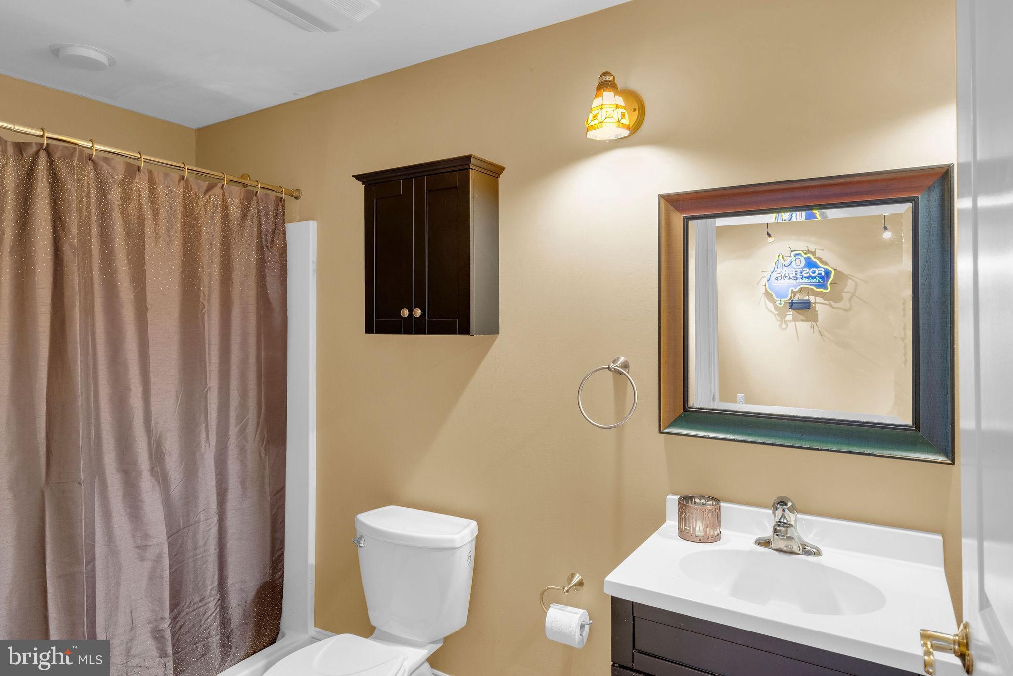 115 Muirfield Lane Chalfont, PA 18914 - Photo 39 of 59 a bathroom with a sink and a mirror