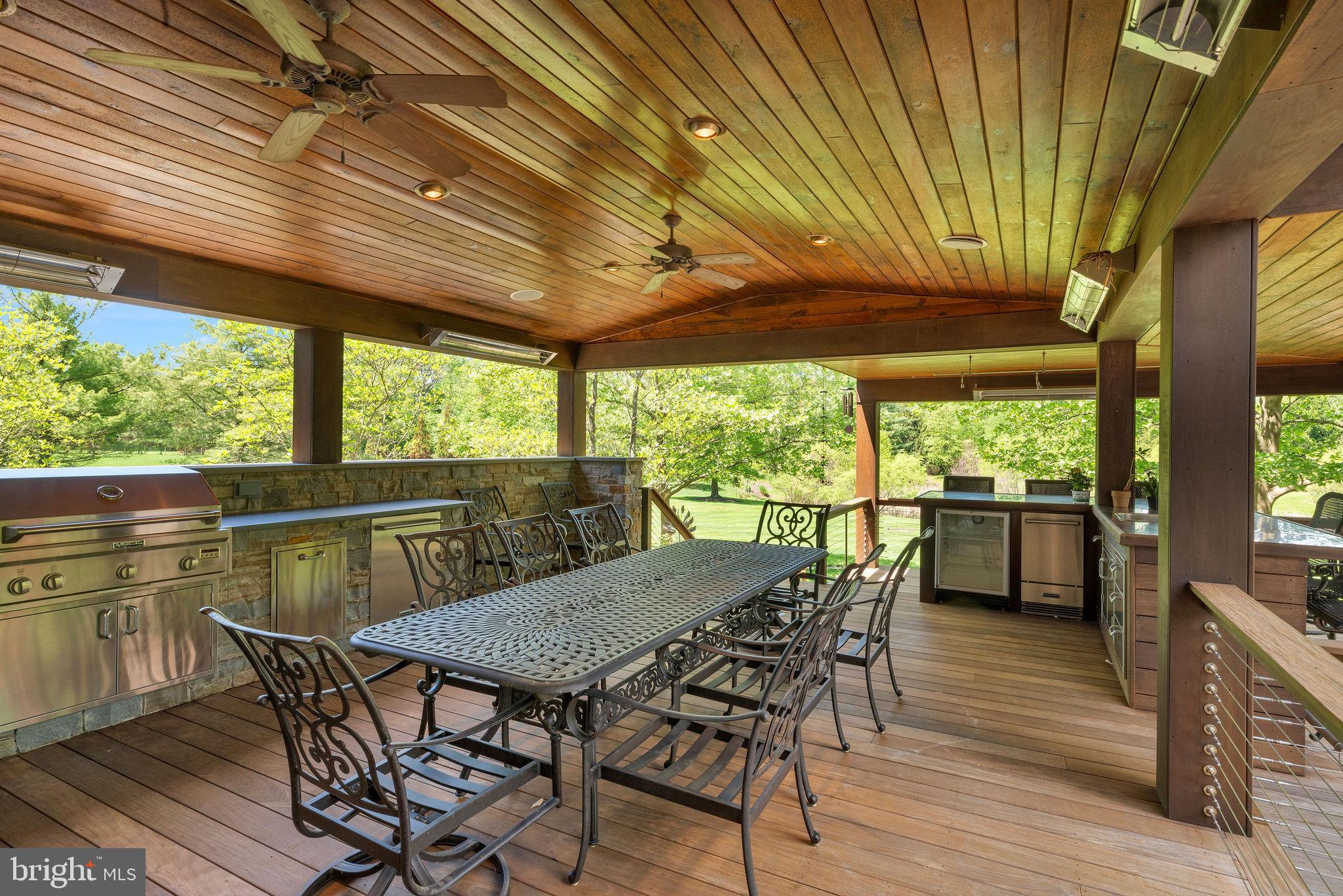 115 Muirfield Lane Chalfont, PA 18914 - Photo 42 of 59 a view of a patio with table and chairs and wooden floor