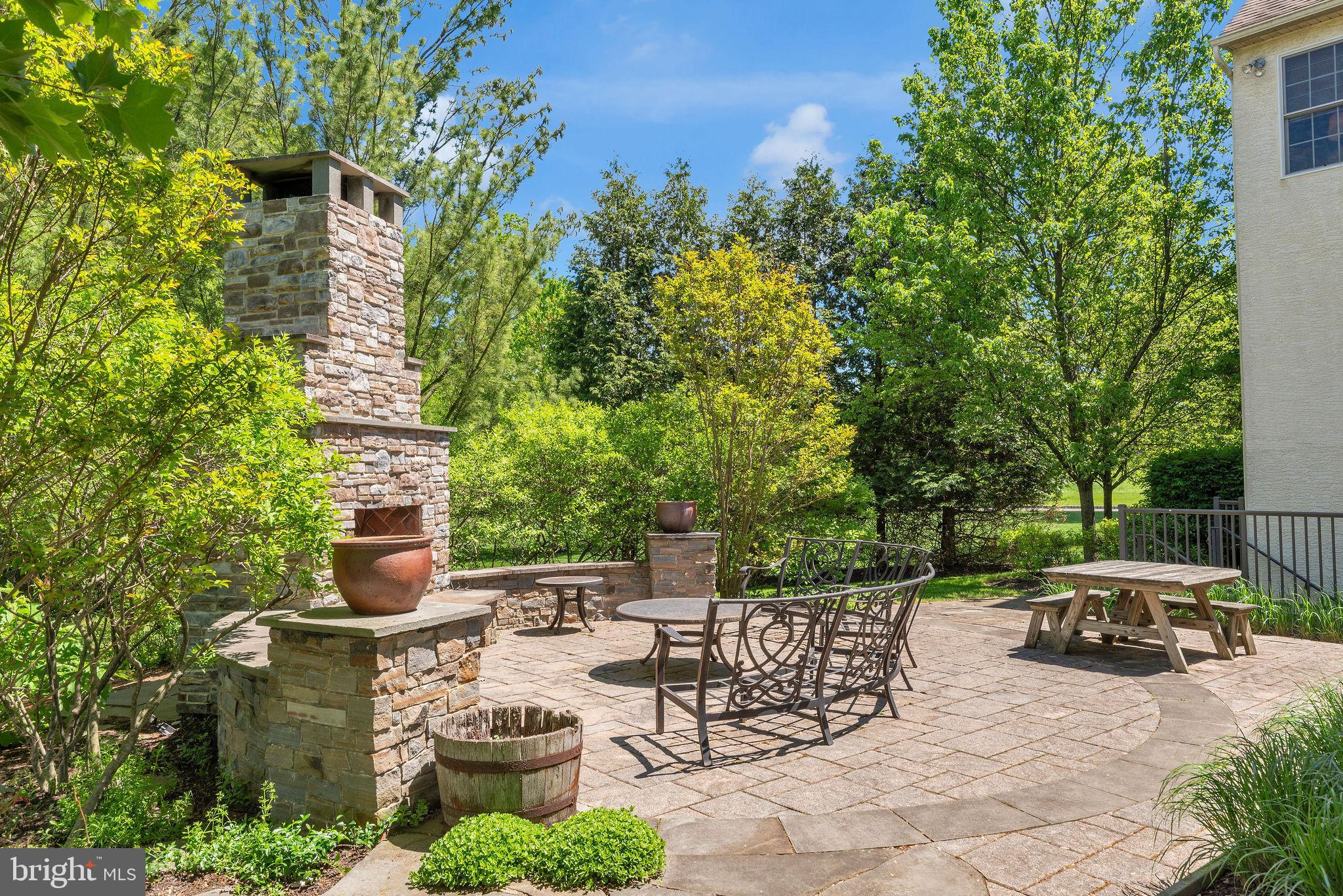 115 Muirfield Lane Chalfont, PA 18914 - Photo 46 of 59 a view of a patio with table and chairs and potted plants