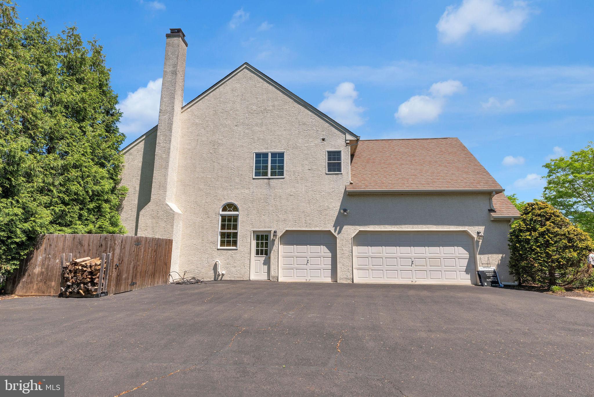 115 Muirfield Lane Chalfont, PA 18914 - Photo 51 of 59 a view of a white house with a yard and garage